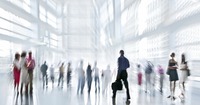 abstakt image of people in the lobby of a modern business center with a blurred background